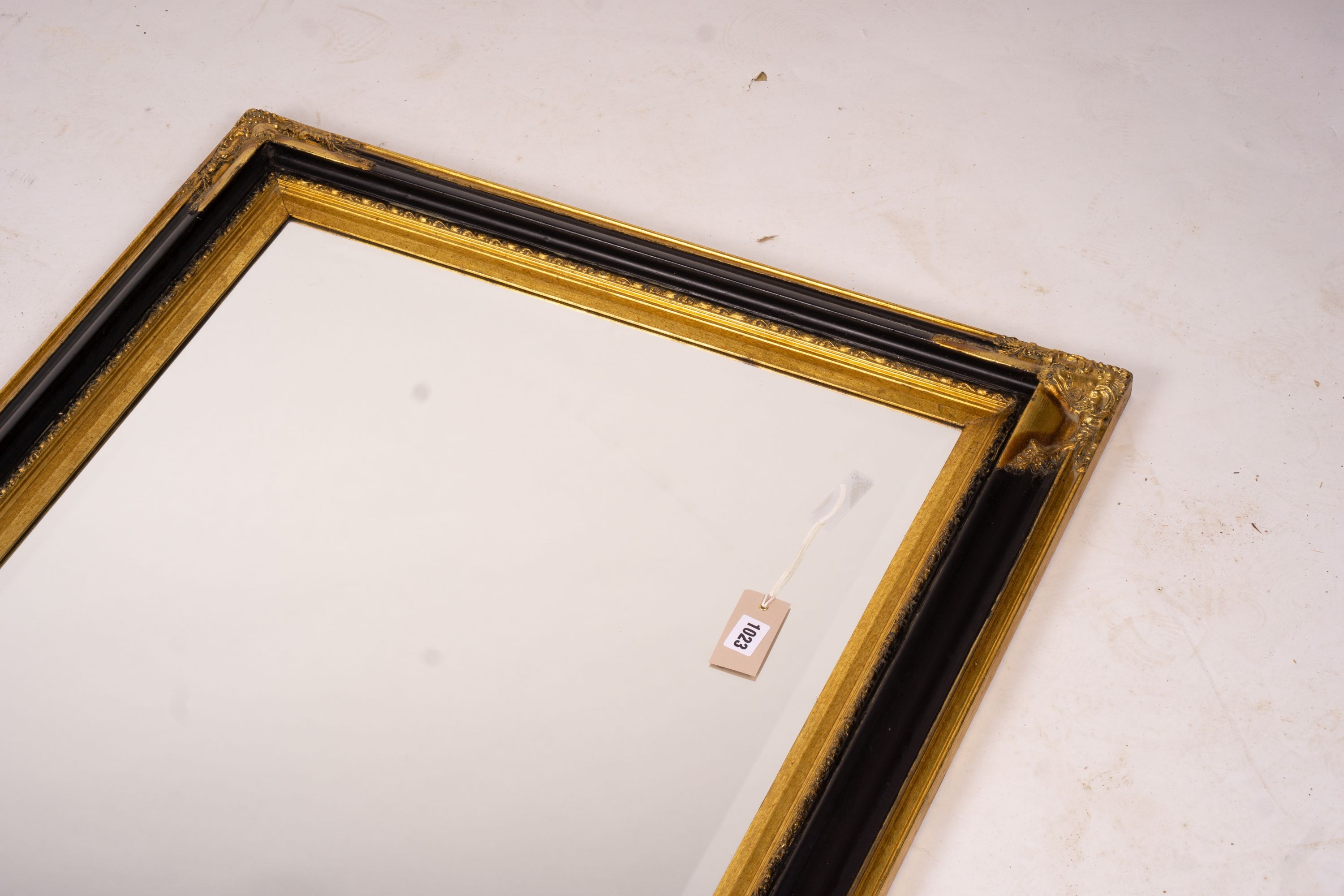 A 19th century French gilt gesso wall mirror, width 64cm, height 116cm together with a modern larger rectangular wall mirror